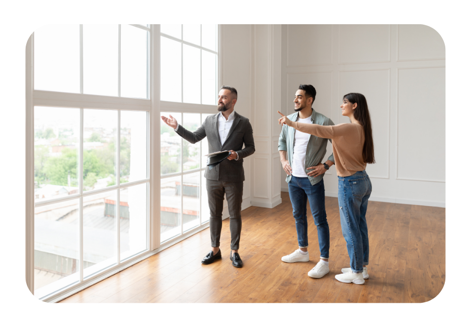 A property owner showing a couple a flat.